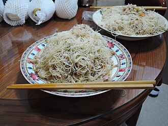 Homemade fried rice noodles in cantonese style — illustrative photo