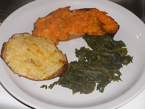 Baked potato, baked sweet potato, and steamed kale — illustrative photo